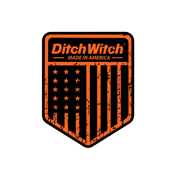 Die‑cut Ditch Witch shield decal featuring a distressed orange American flag design with “Ditch Witch Made in America” text.